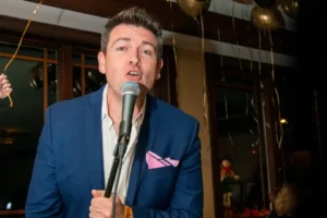 Josh performing live with a microphone as part of Liza & Josh restaurant entertainment in New Jersey