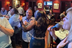 Liza singing as restaurant guests dance and enjoy live music in Bergen County, New Jersey