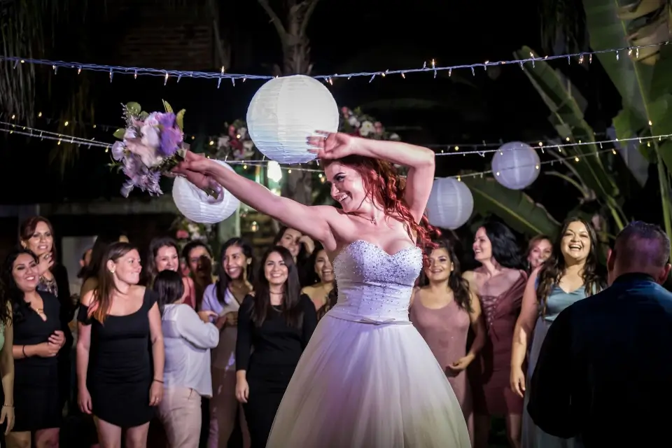 Bride dancing with guests during a lively wedding reception in New Jersey