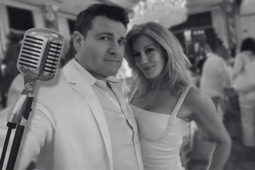 Singing at white party with a vintage microphone while performing at a North Jersey venue