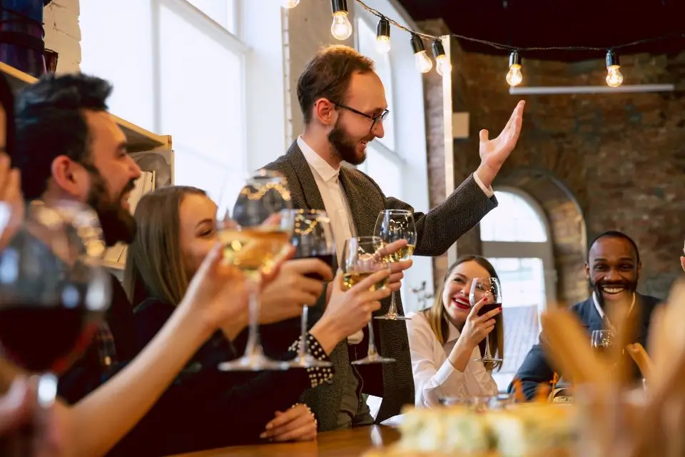 Coworkers raising their glasses during a fun employee appreciation event