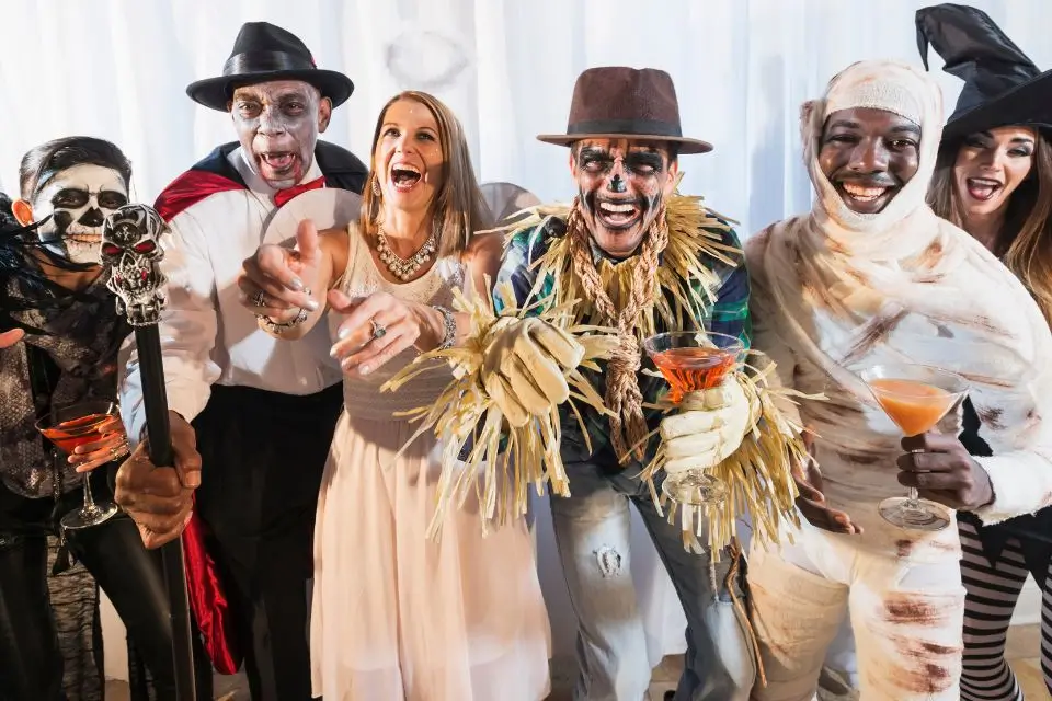 Costumed guests celebrating together at a Halloween private party