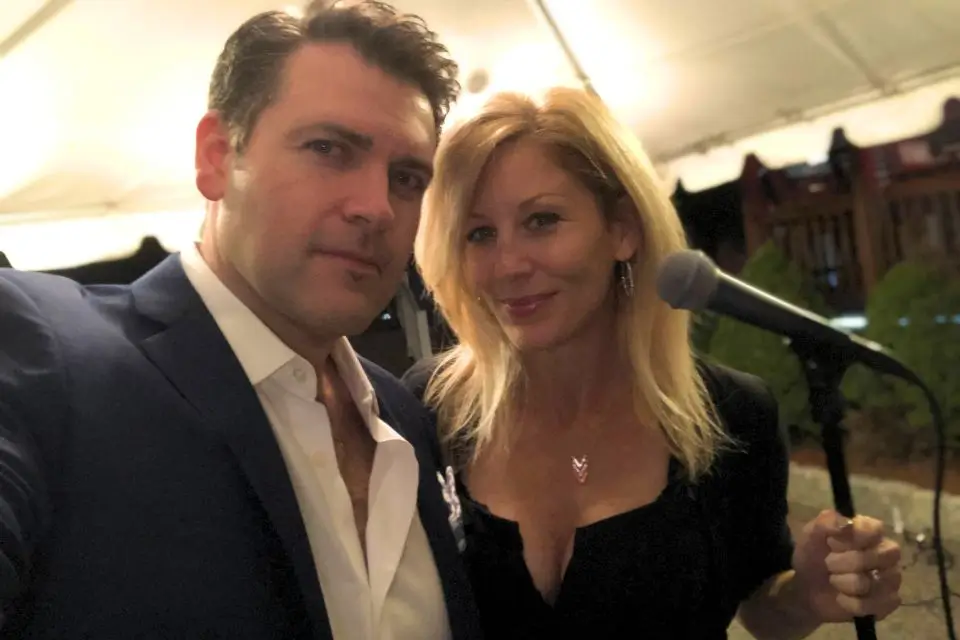 Liza and Josh performing live music and DJing at an outdoor private party in New Jersey