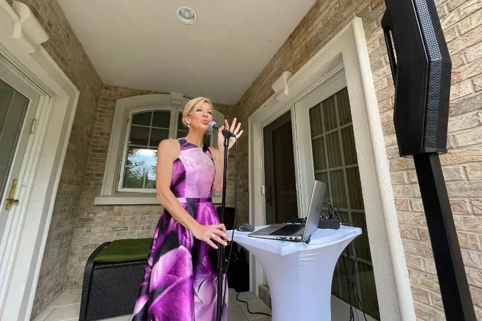 Liza singing at a covered outdoor private party in Northern New Jersey