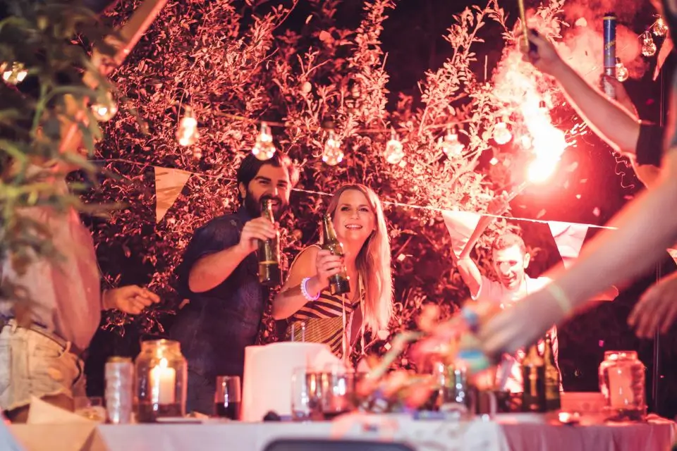 Guests enjoying drinks, music and festive lighting at an outdoor private party in New Jersey