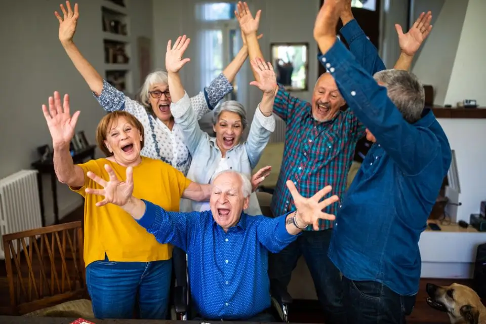 Group of older adults celebrating together at an active retirement community